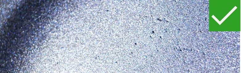 Coated-over dents and craters